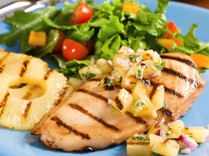 Grilled chicken with pineapple salsa and a salad