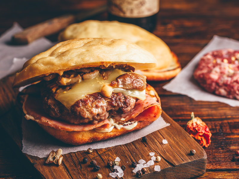 glazed ham on beef burger on a plate