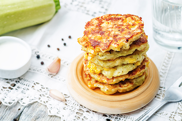 Fried Corn Fritters stacked on plate 
