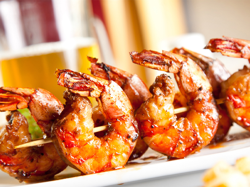 Buffalo flavored shrimp on skewers