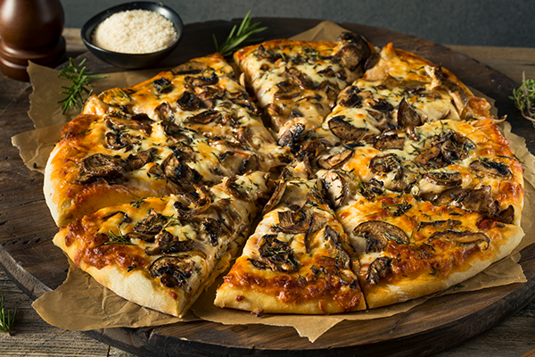 Sliced Mushroom Pizza on serving tray