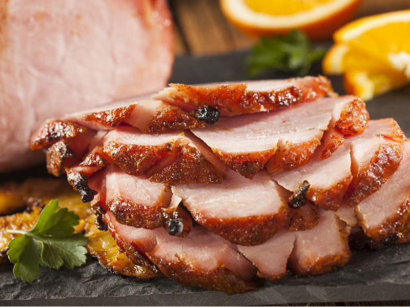 Sliced ham on board
