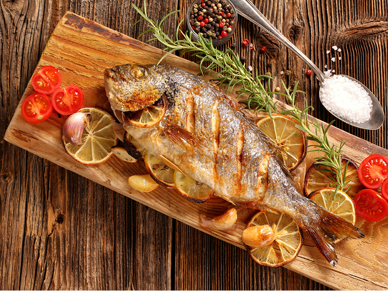 Sliced Fish on a wooden board