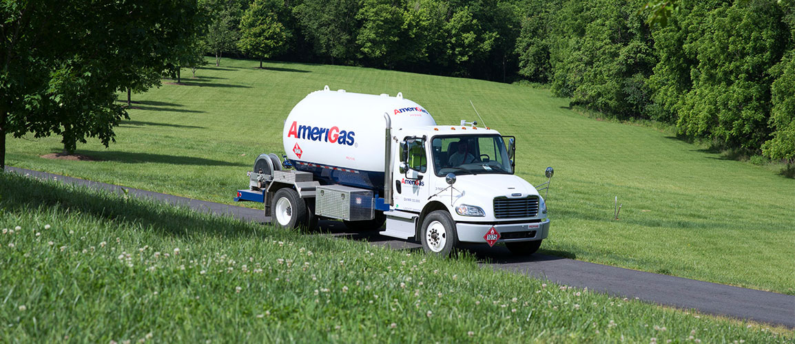 AmeriGas tanker truck on a lush rural road.