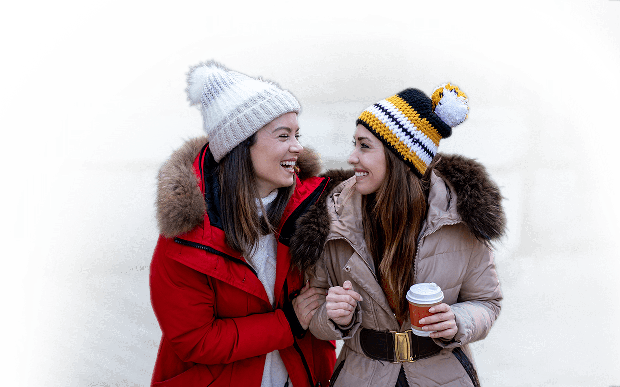 Two women smiling in cold weather