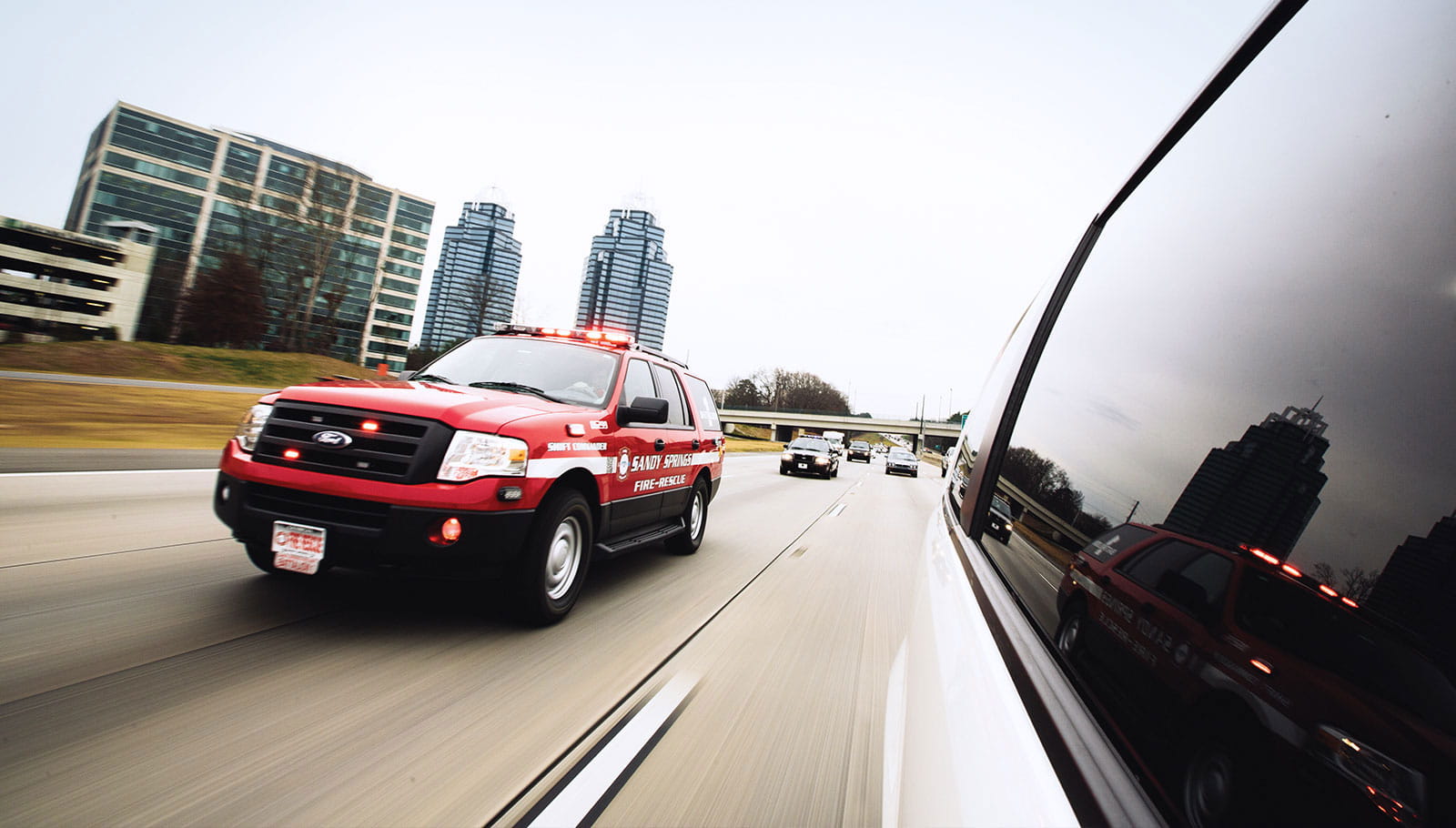 Emergency vehicles on a highway.