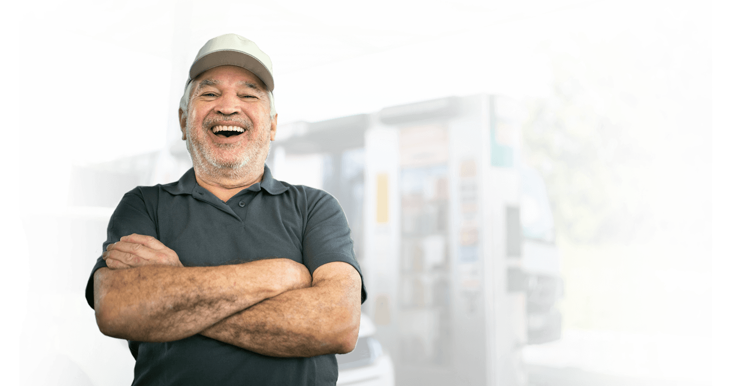 Man with folded arms laughing