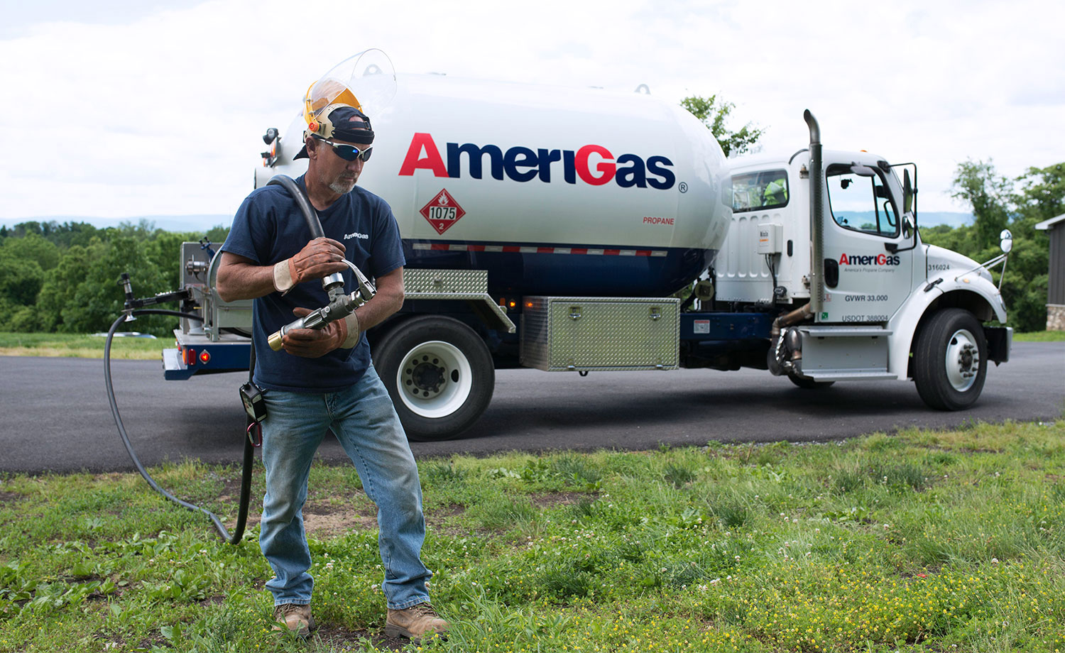 Man carrying propane line.