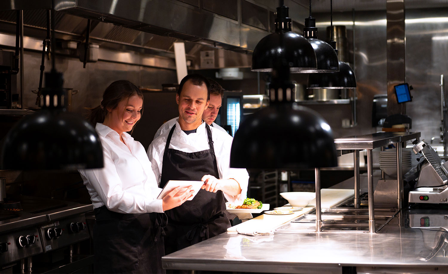 Restaurant staff in the kitchen.