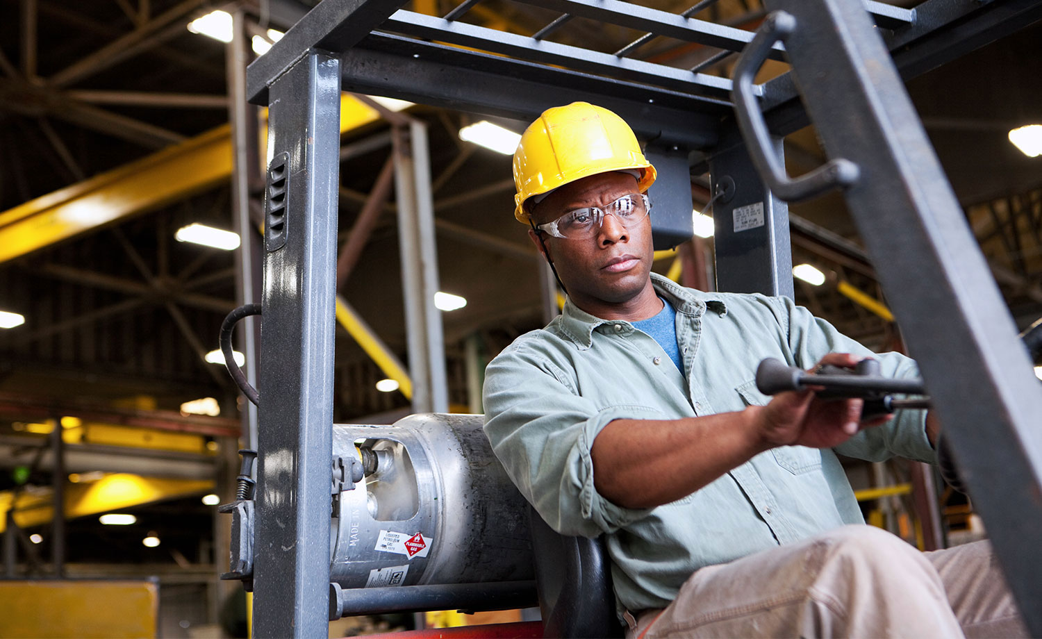 Man driving forklift.