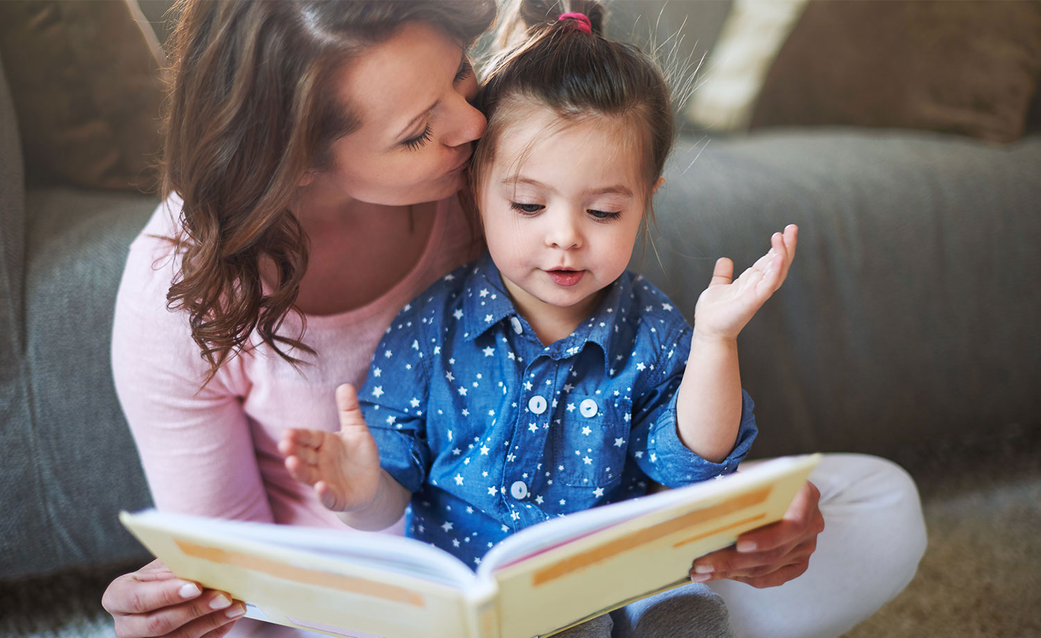 Mother reading to child.