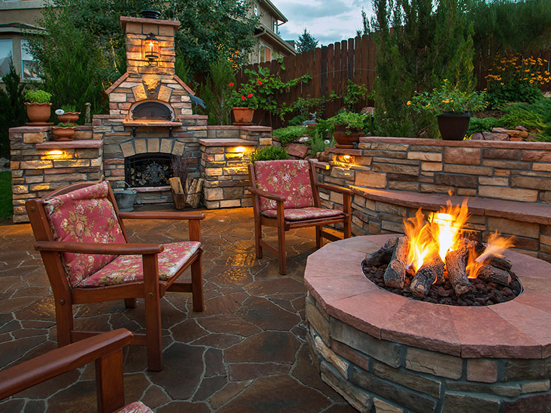 Outdoor patio with firepit and fireplace