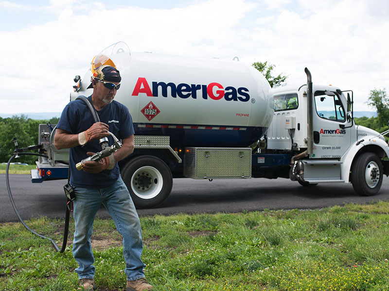 Amerigas Truck with worker holding propane hose
