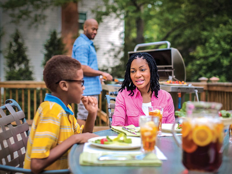 Family grilling outside.