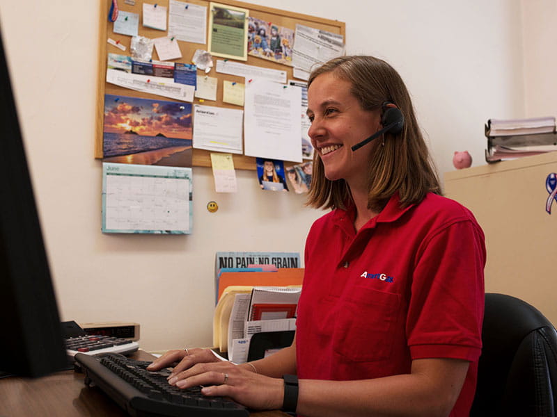 AmeriGas employee with headset on at computer