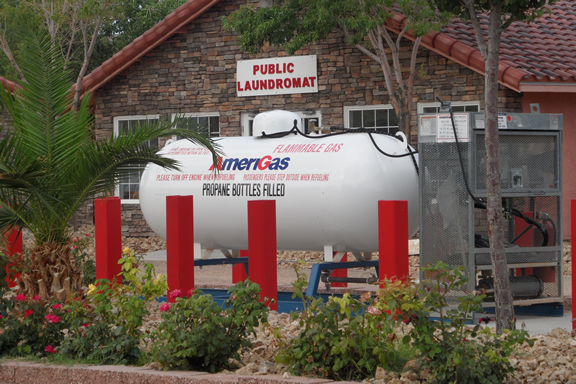 A large propane tank by the side of the house fed the stove and provided.